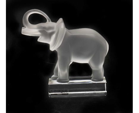 A Lalique frosted glass elephant, 20th century, with raised trunk, on rectangular section plinth base, signed,16cm highCondit