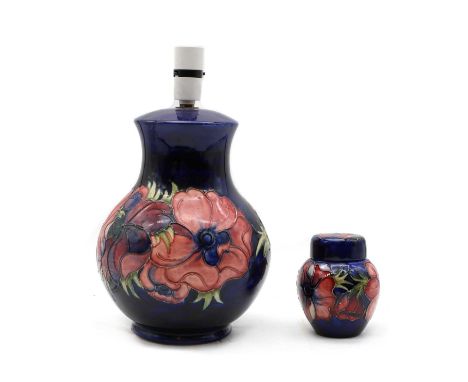 A Moorcroft pottery ‘Anemone’ pattern lamp, of footed baluster form, impressed marks, total 31.5cm hightogether with a Moorcr