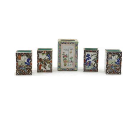 A collection of four Chinese famille rose brush pots,20th century, of square form, each painted with figures in a garden with