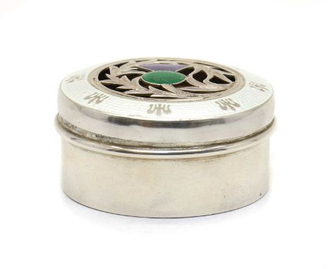 An Edwardian silver trinket box,by Lawrence Emanuel, Birmingham 1908, of circular form, the lid with a white enamel rim encir