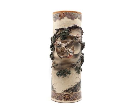 A Japanese Satsuma ware umbrella stand, 20th century, of cylindrical form, decorated with owls and birds among a blossoming t