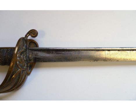 An early 19th century Royal Navy officer's sword with engraved blade, folding knuckle guard, lion’s head pommel and shagreen 
