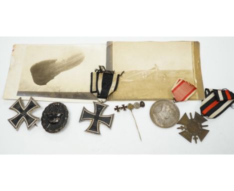 Four First World War German medals; a First Class Iron Cross, a 2nd Class Iron Cross, a 1914-1918 Honour Cross and an Austro-