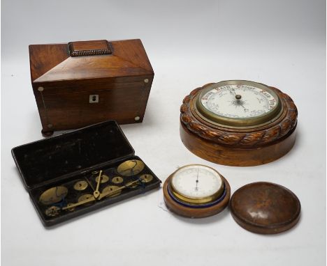 A cased travelling set of scales, a Cary of London small travelling barometer, a tea caddy and a small wall barometer. Condit