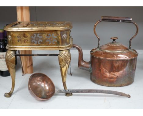 A late Victorian copper kettle, a brass stand and a ladle, largest 39cm wide. Condition - fair