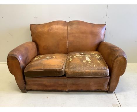 A French leather moustache back sofa, width 148cm, depth 80cm, height 80cm. Condition - poor