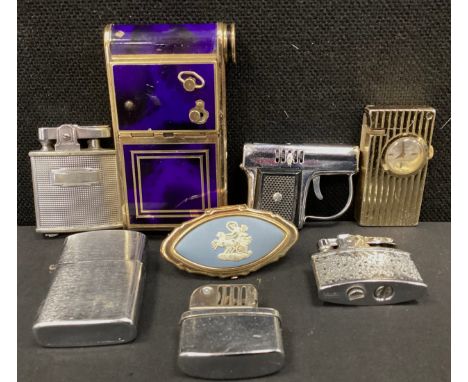 A Swiss Art Deco musical compact by Reuge St Croix;  a ring mirror;  novelty Foska timepiece watch combination pocket lighter