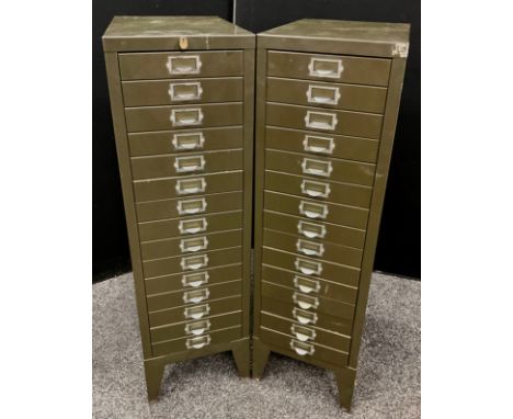 Two vintage ‘Stor’ 15 drawer metal filing cabinets, in dark green finish, one being slightly deeper, and with lock mechanism 