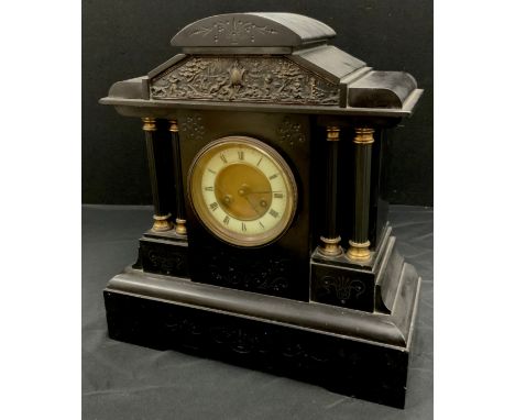 A 19th century black marble mantle clock, black Roman numerals on a cream chapter ring, with a pavilion shaped case with four