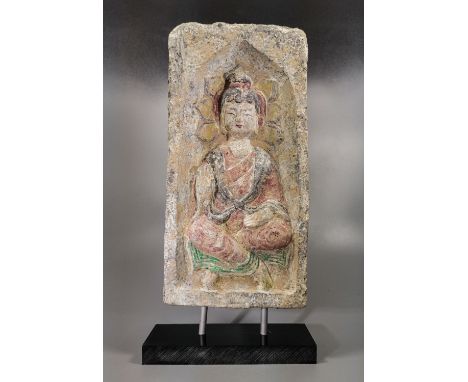 Ca. 386-534 AD. A rectangular ceramic brick with recess to the obverse, featuring a seated Buddha on a lotus flower. Good Con
