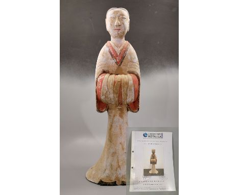 Ca. 200 BC. Large Chinese Han Dynasty pottery female attendant holding her arms in front of her body. She is made from light 