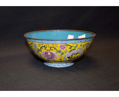 A yellow Canton enamel bowl, decorated with cranes and foliage, geometric border, 17cm diameter