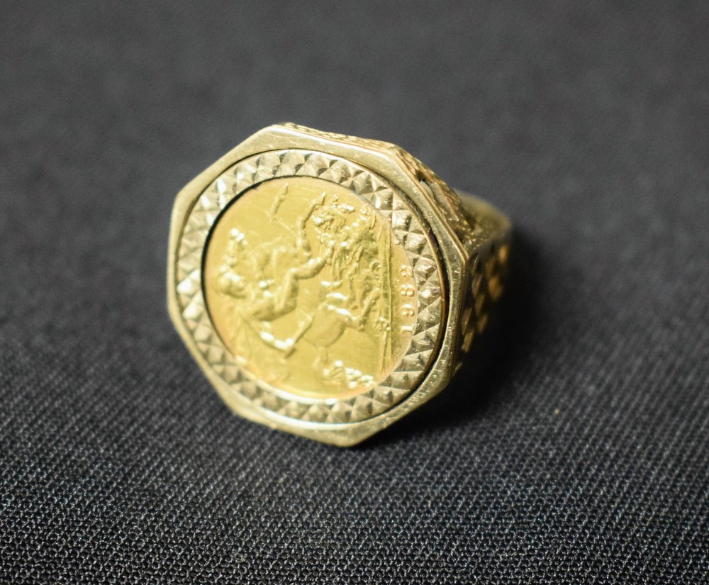 A 1982 half sovereign ring, 9ct gold shank