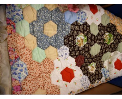 A patchwork quilt doulbe bed spread, hexagonal panels,