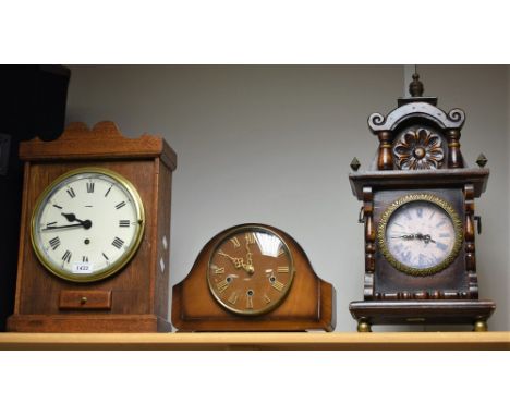 A Smith's mantel clock; an oak Pioneer mantel clock; a battery operated mantel clock. (3)