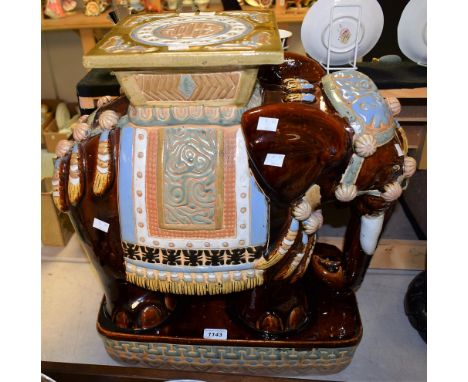 A ceramic jardiniere stand in the form of an elephant