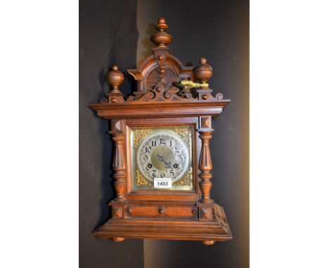 A late 19th century Gothic Revival bracket clock, eight day movement, Arabic numerals on silver chapter ring, turned and carv