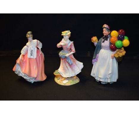 A Royal Doulton ceramic figure, Country Love HN2418; others, Fair Lady HN2835, Biddy Penny Farthing HN1843 (3)
