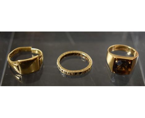 A 9ct gold smoky quartz set ring, modernist square design; a 9ct gold signet ring, a/f; a stone set eternity ring; total gros