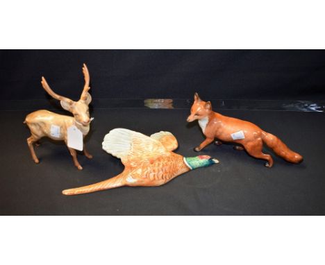 A Beswick ceramic model of a stag; another, fox; a pheasant wall plaque, 661/1 (3)