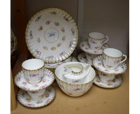 A late 19th/ early 20th century tea set for six comprising sandwich plates, side plates, sugar bowl, cream jug, cups and sauc