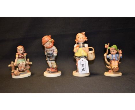A Goebel figure, girl with basket; others, boy in tree; etc (4)
