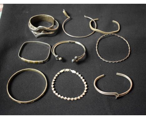 Silver bracelets and bangles to include dolphin decorated bangle; twist bangle; etc (10) 