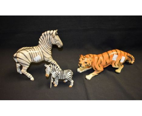A Beswick ceramic model of a zebra; another Szeiler; a Contendorf tiger (3)