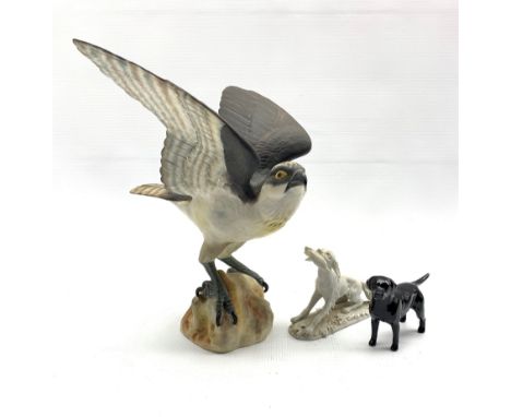 Spode bisque model of an osprey H29cm, Beswick black Labrador and a biscuit porcelain model of a Hunting dog marked Triade be