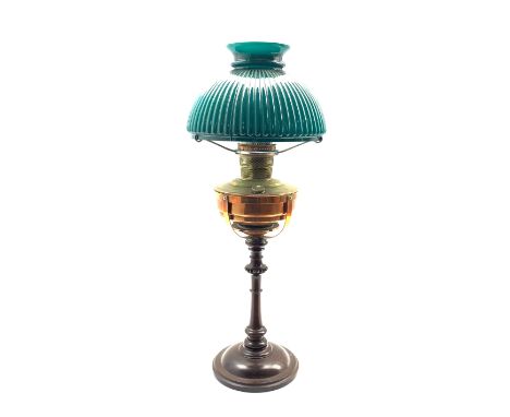 Late 19th century turned wooden oil lamp with copper frame and reservoir, green glass ribbed shade and clear glass chimney, H