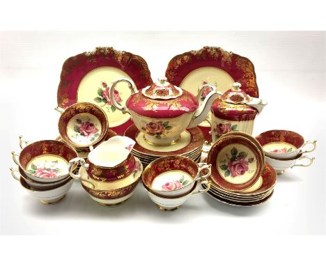 1950's Paragon Fine Bone China tea service for twelve persons, centrally decorated with roses within gilt crimson bands, patt
