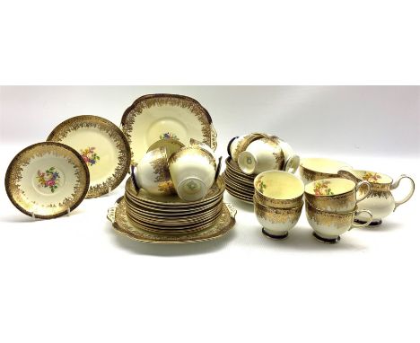 Collingwood Bros. tea set decorated with floral sprays within a blue and gilt border comprising twelve cups and saucers, twel