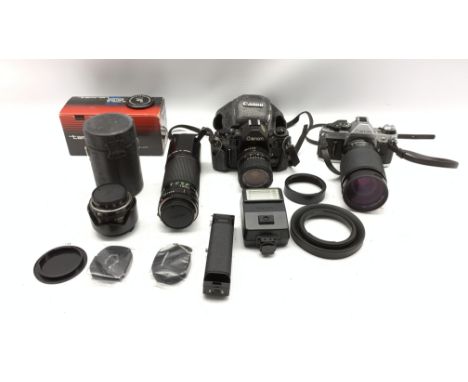 Canon AE1 Program camera with Tamron 1:3.5-4.2 lens, Canon A1 camera with1:3.5-4.5 zoom lens, three Canon lenses in case and 