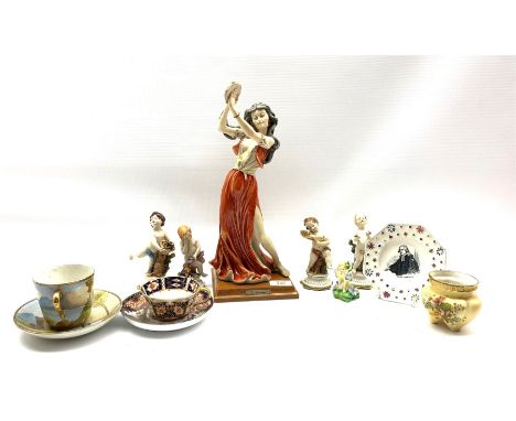 G Armani figure of a dancer, set of four Capodimonte figures of The Seasons, Royal Doulton figure of a fairy HN1379, small Wo