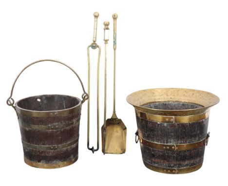 AN OAK AND BRASS BOUND FIRE BUCKET with out-turned rim and loop handles, 31cm high x 41cm diameter; together with another sim