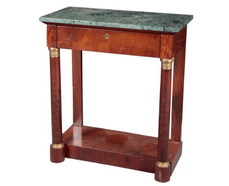 AN EMPIRE MAHOGANY CONSOLE TABLE the green marble top over a single frieze drawer, the turned columnar supports with gilt met