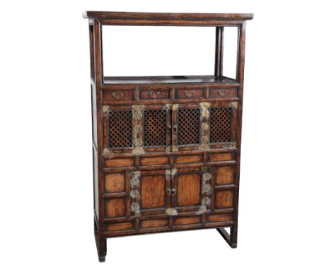 A KOREAN ELM TALL CABINET20th century, with an open shelf over an arrangement of four short drawers and two cupboards, 156cm 