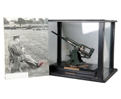 SIR WINSTON CHURCHILL INTEREST: A SIGNED PHOTOGRAPH AND ACCOMPANYING MODEL the photograph depicting Sir Winston seated and su