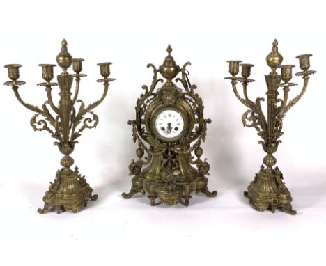 A FRENCH BRASS MANTEL CLOCK (3)51cm high, with matching four branch garniture, 51cm high
