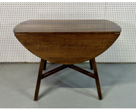 ERCOL; A MID 20TH CENTURY CIRCULAR DROP FLAP DINING TABLE108cm wide; 72cm high