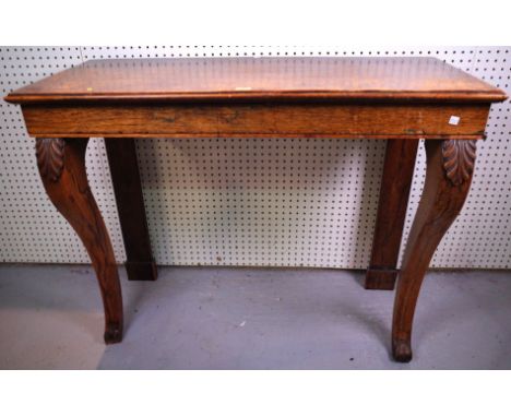 A REGENCY ROSEWOOD RECTANGULAR CONSOLE TABLE ON SABRE SUPPORTS106cm wide; 46cm deep; 81cm high, top later