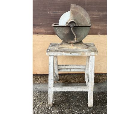 AN EARLY 20TH CENTURY MANUAL KNIFE SHARPENER ON PINE BASE53cm wide, 112cm tall