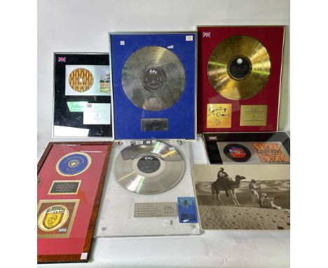 ENTERTAINMENT MEMORABILIA: GROUP OF FRAMED PRESENTATION DISKS, CAMPAIGN BOOKS AND FILM PROPS (10)Including presentation disks