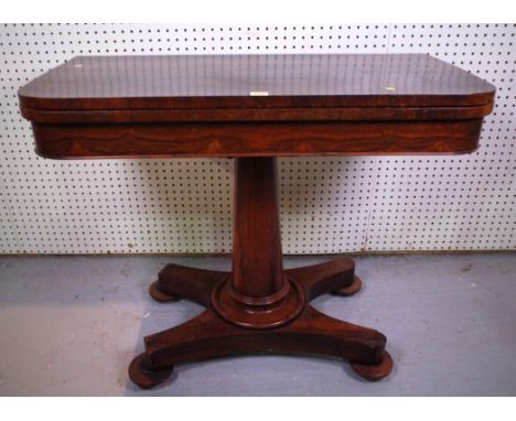 A REGENCY ROSEWOOD FOLDOVER CARD TABLE92cm wide; 46cm deepOld marks and scratches all over, top section is slightly loose fro