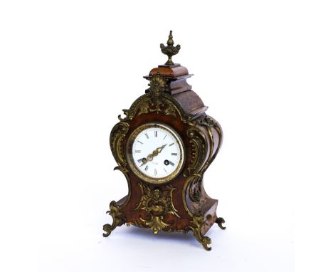 HENRY MARC, PARIS: A FRENCH GILT-METAL MOUNTED WALNUT MANTEL CLOCKLate 19th Century, with enamel dial with Roman hours and pi