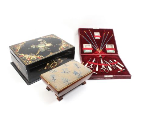Three sewing boxes comprising a mid Victorian papier mache example, the black ground with mother of pearl and painted decorat