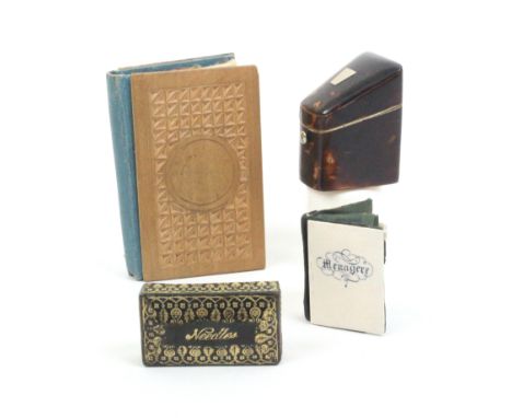 Four needle books and boxes comprising a tortoiseshell example of knife box form, white metal lid plaque, bone internal divis