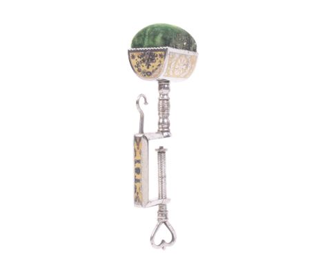 An attractive part gilded steel sewing clamp, the rectangular frame mounted with a hook below a trough form pincushion, gilde