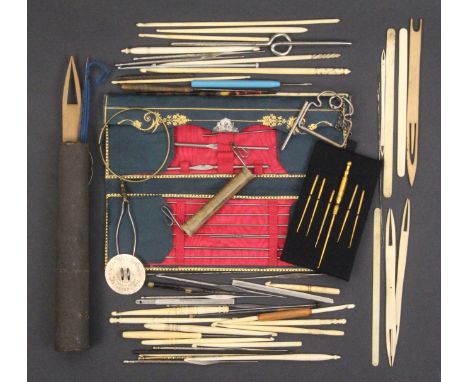 A collection of crochet hooks and related items comprising a French gilt tooled leather case with steel catch the interior si