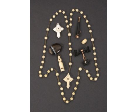 Seven charms and novelties all with Stanhopes comprising a bone rosary cross and beads (Sacre Couerƒ.), 60cm, a mother of pea